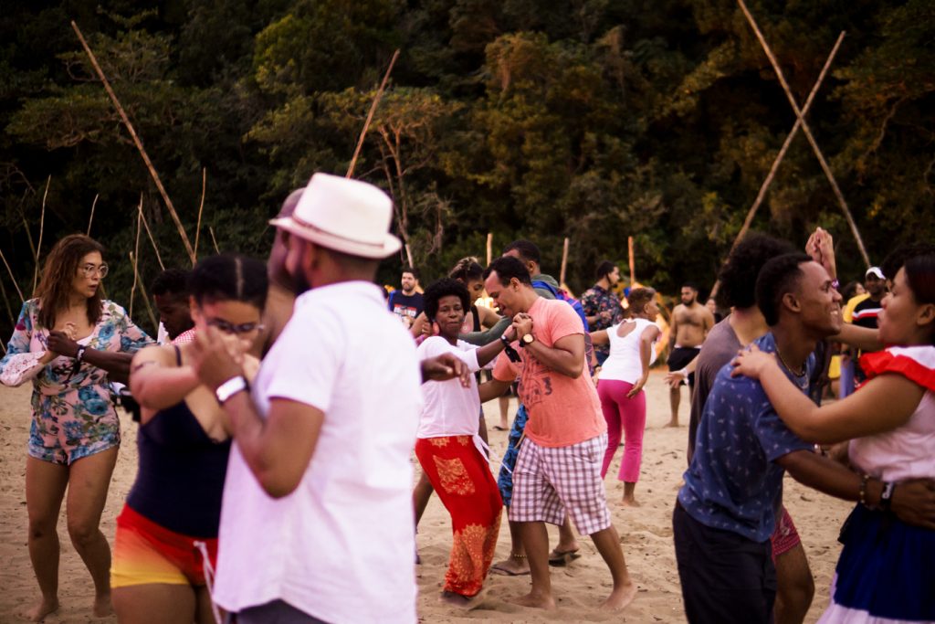 crowd dancing on the beach at the Quelonios Festival in Dominican Republic