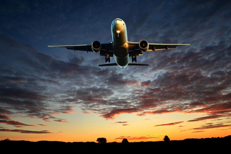 Image of a plane taking off to represent the transportation service